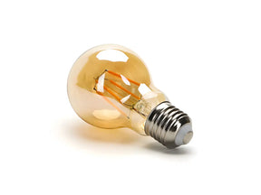 E27 LED Lamp filament A60 5W 2200K dimbaar, liggend weergegeven en onder een hoek (foto 1)